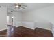 Spacious living room with hardwood floors and fan, perfect for relaxing or entertaining guests at 581 S Roosevelt St, Tempe, AZ 85281