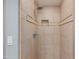 Close up of the shower area with neutral tile and updated fixtures at 581 S Roosevelt St, Tempe, AZ 85281