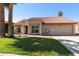 Charming single story home with a red tile roof, a two car garage, and desert landscaping in front at 5841 W Kesler St, Chandler, AZ 85226