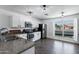 Bright kitchen with stainless steel appliances, a granite countertop, and a window with a view at 5841 W Kesler St, Chandler, AZ 85226