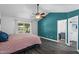 Main bedroom featuring a vaulted ceiling, fan, and ensuite bath at 5841 W Kesler St, Chandler, AZ 85226