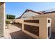 Enclosed patio features brick accents, a built-in bench, and stylish landscaping, offering privacy at 5841 W Kesler St, Chandler, AZ 85226