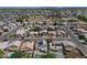 Aerial view of a neighborhood with tree-lined streets and community park at 8599 W Athens St, Peoria, AZ 85382