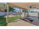 Covered patio featuring a backyard with artificial grass and fenced pool at 8599 W Athens St, Peoria, AZ 85382