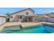 Backyard featuring a fenced pool, patio, and lush landscaping at 8599 W Athens St, Peoria, AZ 85382