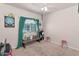 Clean bedroom featuring hardwood floors, a window, and an interesting decorative touch at 8599 W Athens St, Peoria, AZ 85382
