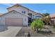 Charming single-Gathering home with a well-manicured front yard and a two-car garage at 8599 W Athens St, Peoria, AZ 85382