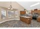 Bright kitchen with a breakfast nook, tile floors, and a view of the backyard at 8599 W Athens St, Peoria, AZ 85382
