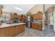 Well-lit kitchen featuring a skylight, stainless steel appliances, and oak cabinetry at 8599 W Athens St, Peoria, AZ 85382