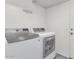 Modern laundry room featuring front loading washer and dryer at 8599 W Athens St, Peoria, AZ 85382