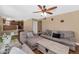 Spacious living room displays direct access to the kitchen with hardwood floors at 8599 W Athens St, Peoria, AZ 85382