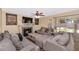Inviting living room offers comfortable seating, a fireplace, and access to outdoor space at 8599 W Athens St, Peoria, AZ 85382