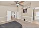 Large bedroom features lots of wall decor, an ensuite bathroom, and ceiling fan at 8599 W Athens St, Peoria, AZ 85382