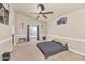 Bright main bedroom shows a large window with neutral walls and decor at 8599 W Athens St, Peoria, AZ 85382