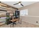 Modern home office boasts a desk, shelving, and a trendy accent wall at 8599 W Athens St, Peoria, AZ 85382