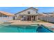 Backyard featuring a fenced pool, patio and grassy area at 8599 W Athens St, Peoria, AZ 85382