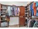 Spacious walk-in closet provides ample storage and organization with custom shelving at 8599 W Athens St, Peoria, AZ 85382