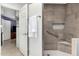 Modern bathroom with tiled walk-in shower, grab bar, and shower niche at 9389 N 87Th Way, Scottsdale, AZ 85258