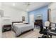 Bright bedroom with natural light, ensuite bath and neutral tile flooring at 9389 N 87Th Way, Scottsdale, AZ 85258