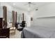 Well-lit bedroom with large windows, ceiling fan, and neutral tile flooring at 9389 N 87Th Way, Scottsdale, AZ 85258