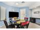 Breakfast nook featuring blue walls, a ceiling fan, and a table with chairs at 9389 N 87Th Way, Scottsdale, AZ 85258