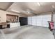Spacious two-car garage with ample storage, overhead lighting, and epoxy flooring at 9389 N 87Th Way, Scottsdale, AZ 85258