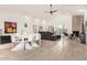 Spacious living space featuring a dining area, comfortable seating, and cozy fireplace at 9389 N 87Th Way, Scottsdale, AZ 85258