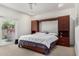 Bright main bedroom featuring a large bed, modern built-ins, and access to an outdoor space at 9389 N 87Th Way, Scottsdale, AZ 85258
