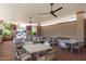 Community patio features ample seating, overhead fans, brick floors, and a lounging area at 9389 N 87Th Way, Scottsdale, AZ 85258