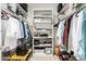 Spacious walk-in closet with custom shelving and racks for ample storage at 9389 N 87Th Way, Scottsdale, AZ 85258