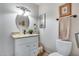 Well-lit bathroom with granite countertop vanity and decoratively framed mirror and lighting at 9450 N 94Th Pl # 116, Scottsdale, AZ 85258