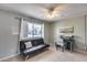 Cozy bedroom with neutral walls, tile flooring and a ceiling fan for added comfort at 9450 N 94Th Pl # 116, Scottsdale, AZ 85258