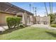 Community grilling area with built-in grills, seating, and lush landscaping for outdoor cooking at 9450 N 94Th Pl # 116, Scottsdale, AZ 85258