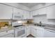 Bright kitchen features modern appliances, granite countertops, and ample cabinet space at 9450 N 94Th Pl # 116, Scottsdale, AZ 85258