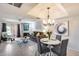 Open concept living room with fireplace, dining area and abundant natural light at 9450 N 94Th Pl # 116, Scottsdale, AZ 85258