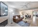 Cozy living room with a fireplace, comfortable seating, and an open floor plan at 9450 N 94Th Pl # 116, Scottsdale, AZ 85258