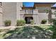 Exterior view of a covered patio surrounded by lush greenery, offering a private outdoor space at 9450 N 94Th Pl # 116, Scottsdale, AZ 85258