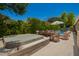 Backyard showcasing a hot tub, outdoor dining set, pool and seating area, perfect for entertaining at 963 S Colonial Dr, Gilbert, AZ 85296