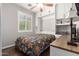 Guest bedroom featuring a built-in murphy bed, desk, and hardwood floors at 963 S Colonial Dr, Gilbert, AZ 85296