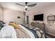Bedroom featuring a comfortable bed, dresser and a flat screen television at 963 S Colonial Dr, Gilbert, AZ 85296