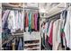 Organized walk-in closet with ample storage space for clothing and accessories at 963 S Colonial Dr, Gilbert, AZ 85296