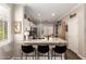 Bright kitchen featuring granite countertops, white cabinets, and a breakfast bar with seating at 963 S Colonial Dr, Gilbert, AZ 85296