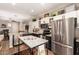 Modern kitchen with stainless steel appliances, granite countertops, and a center island at 963 S Colonial Dr, Gilbert, AZ 85296