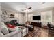 Cozy living room featuring hardwood floors, a plush sofa and an inviting atmosphere at 963 S Colonial Dr, Gilbert, AZ 85296