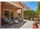 Inviting covered patio with ample seating, complemented by a view of the well-maintained backyard at 963 S Colonial Dr, Gilbert, AZ 85296
