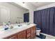 Spacious bathroom with a double sink vanity and a separate toilet/shower area at 12026 W Salter Dr, Sun City, AZ 85373