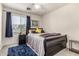 Bedroom featuring a sled bed with dark wood frame, blue accents and decor at 12026 W Salter Dr, Sun City, AZ 85373