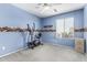 Blue bedroom featuring exercise equipment and a sports-themed border at 12026 W Salter Dr, Sun City, AZ 85373