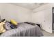 Bedroom showcasing a cozy bed, warm gray bedding, and a mirrored closet at 12026 W Salter Dr, Sun City, AZ 85373