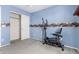 Bedroom showcasing a exercise equipment and a sports-themed border at 12026 W Salter Dr, Sun City, AZ 85373